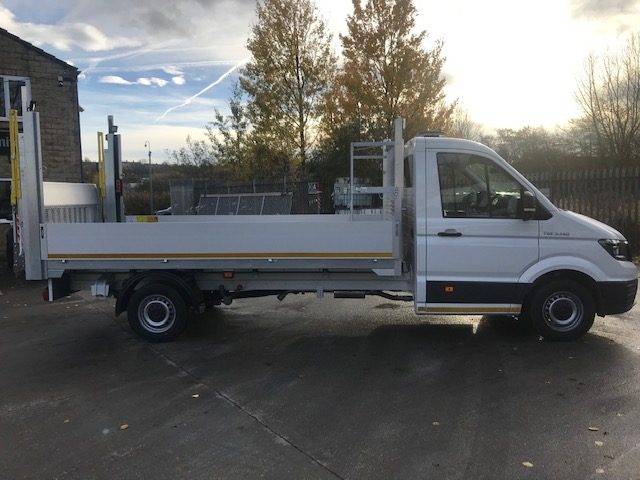 MAN TGE dropside flatbed conversion, side view