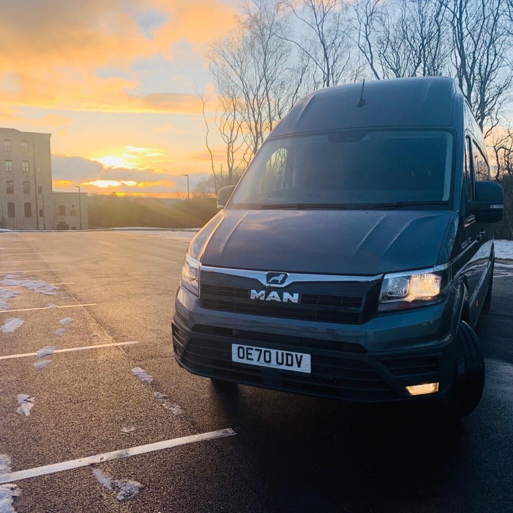 MAN TGE panel van at sunset