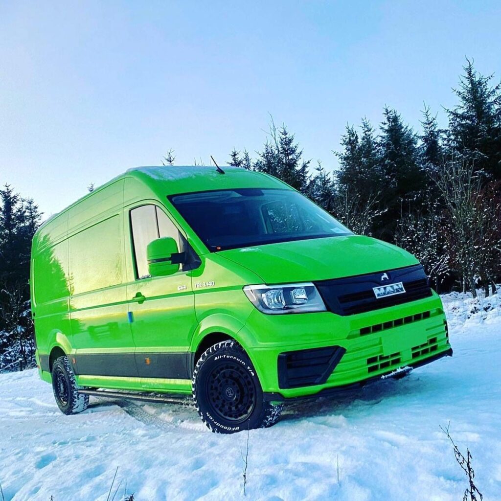 Green MAN TGE panel van in winter conditions
