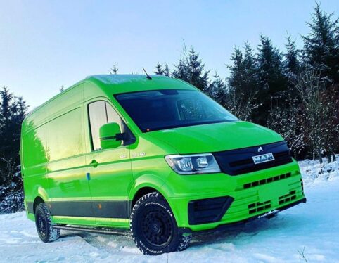 Green MAN TGE panel van in winter conditions