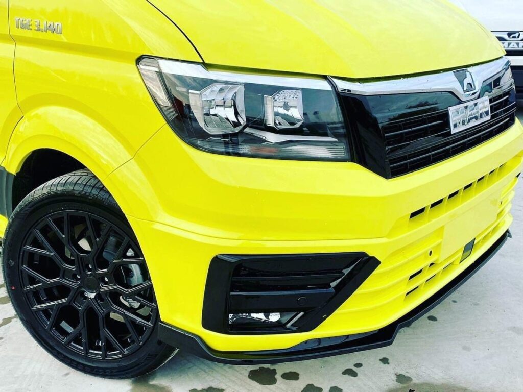 MAN TGE van finished in high-visibility yellow, front view