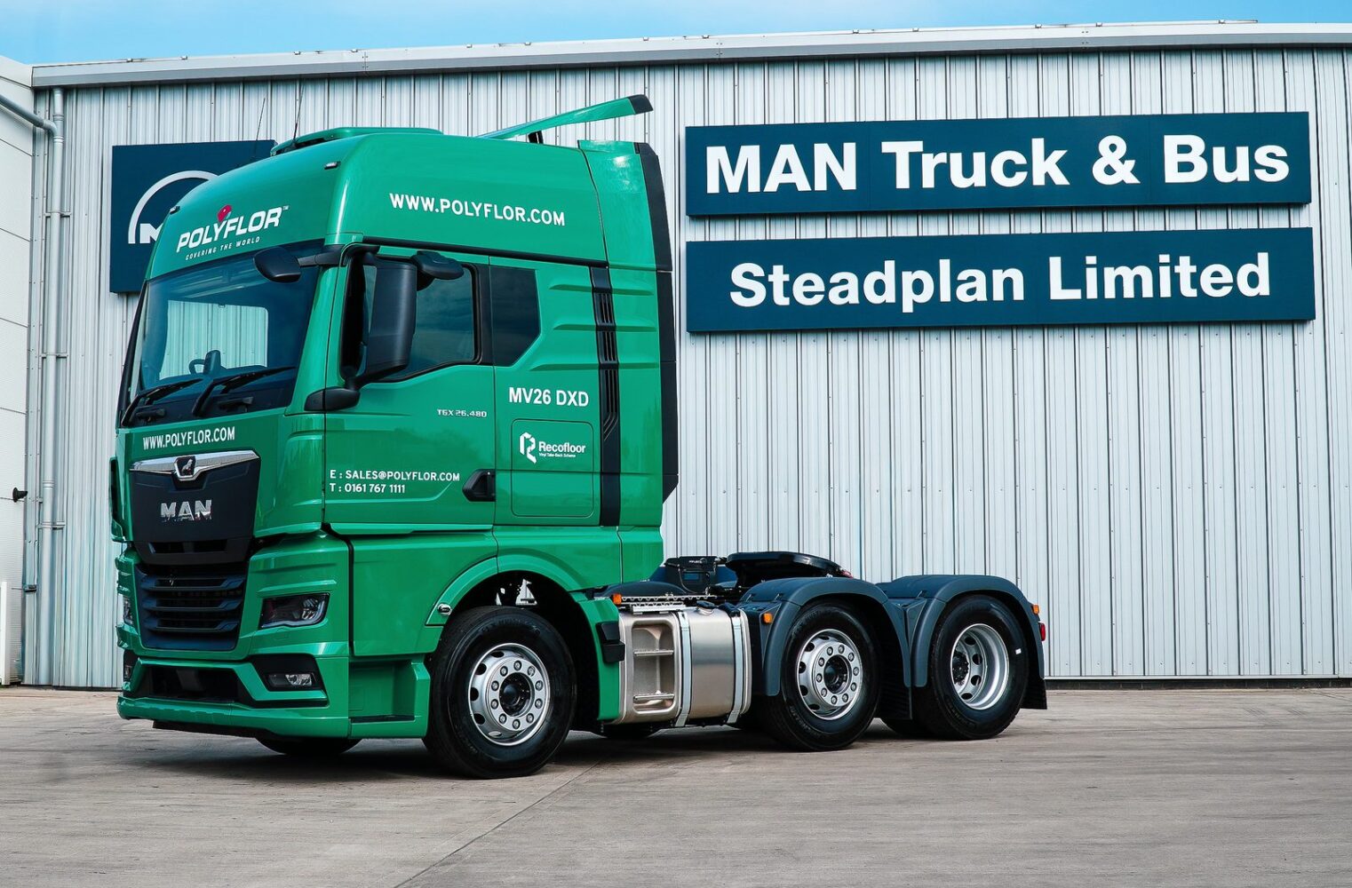 Green MAN TGX tractor unit supplied by Steadplan to Polyflor, outside MAN Truck and Bus Steadplan Limited
