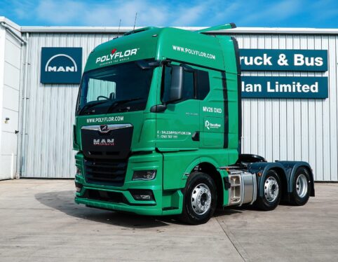 Front three-quarter view of a green MAN TGX tractor unit in Polyflor livery supplied by Steadplan
