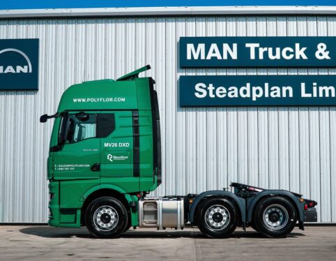 Side view of a green MAN TGX 6x2 tractor unit supplied by Steadplan fleet sales