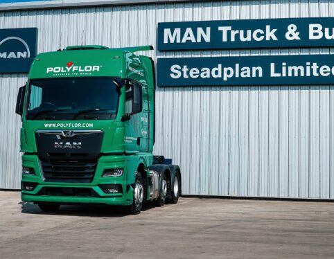 Front view of a green MAN TGX tractor unit in Polyflor livery at Steadplan