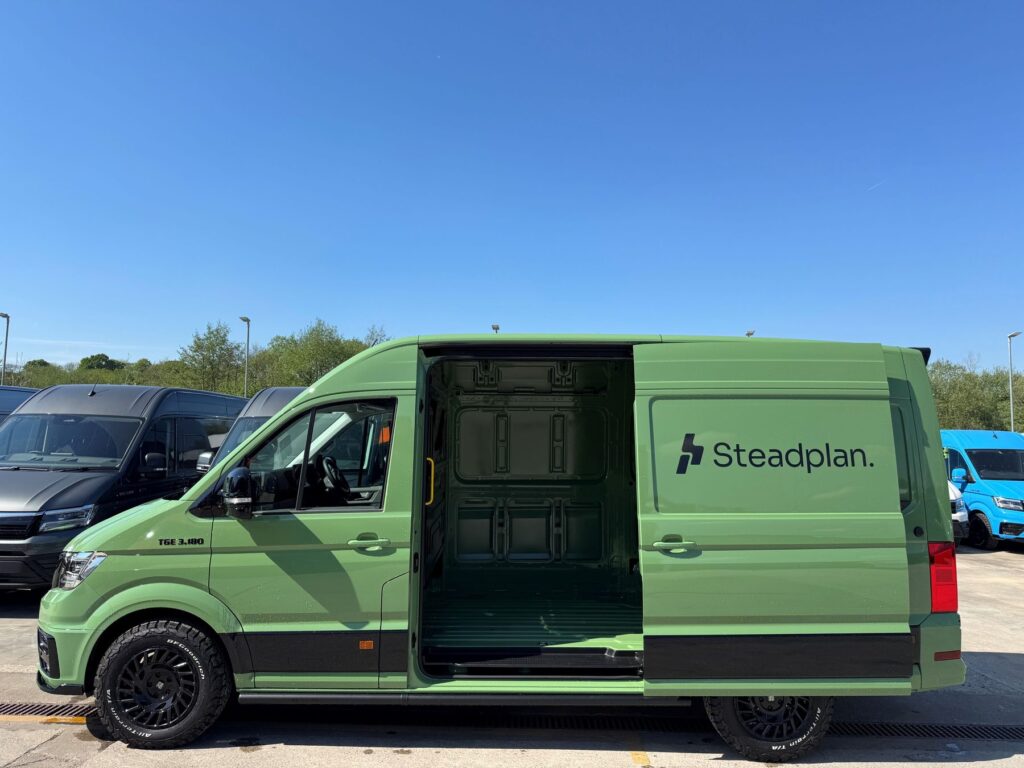 Steadplan liveried MAN TGE van with side loading door open