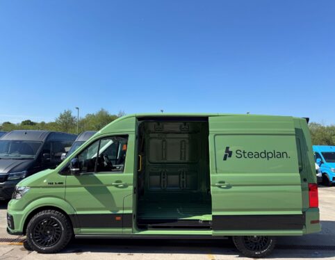 Steadplan liveried MAN TGE van with side loading door open