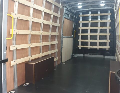 Ply lined van interior with load restraint rails