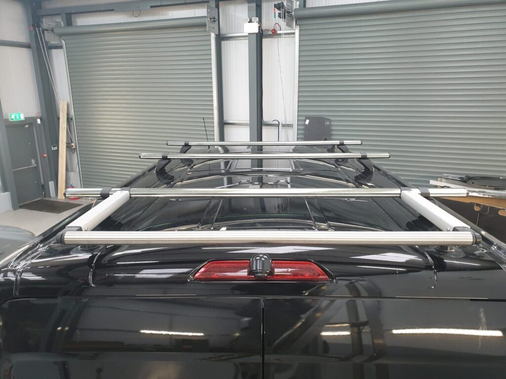 Roof rack and roller system fitted to a van