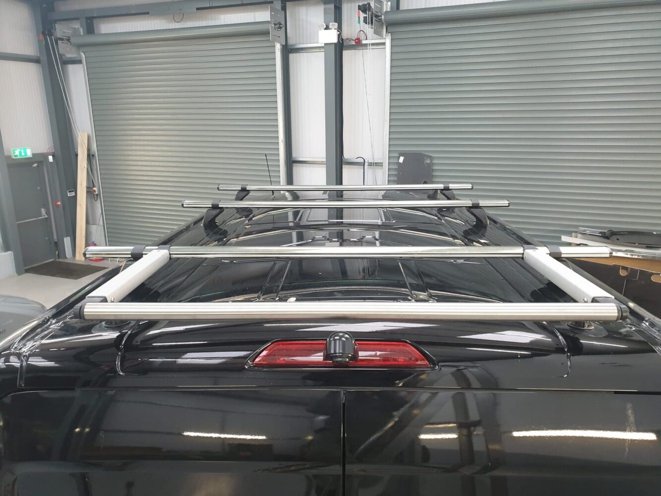 Roof rack and roller system fitted to a van