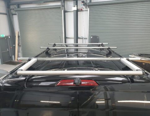 Roof rack and roller system fitted to a van