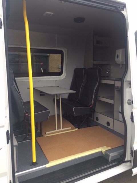 Welfare van conversion interior with seating and storage