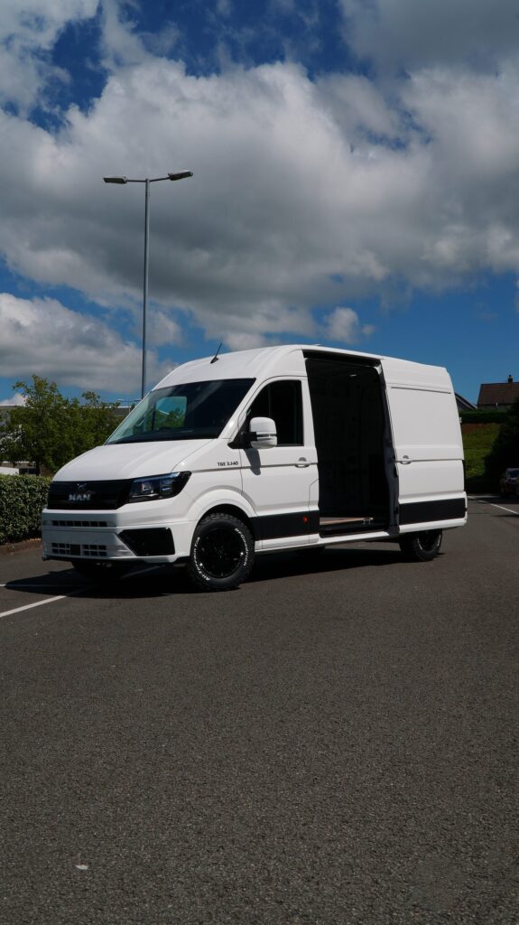 White MAN TGE van with black alloy wheels fitted by Steadplan